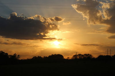 Scenic view of silhouette trees against sky during sunset