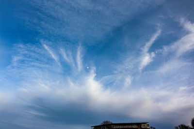 Low angle view of building against blue sky