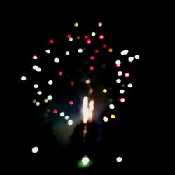 Defocused image of illuminated lights at night