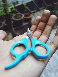 Cropped hand of person holding key ring