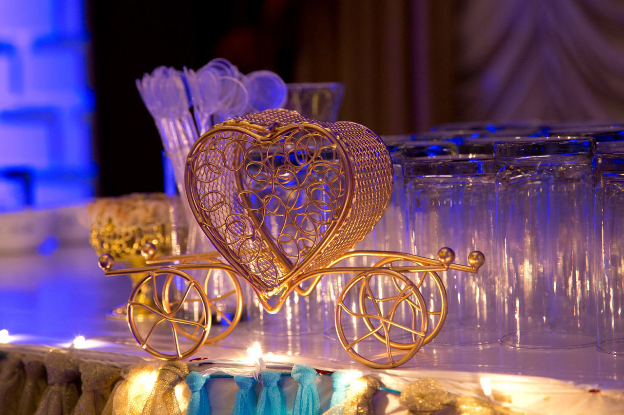 CLOSE-UP OF ILLUMINATED LAMP ON TABLE