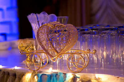 Close-up of illuminated glass on table