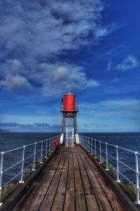 Pier over sea against sky