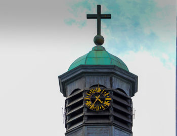 Low angle view of clock tower against sky