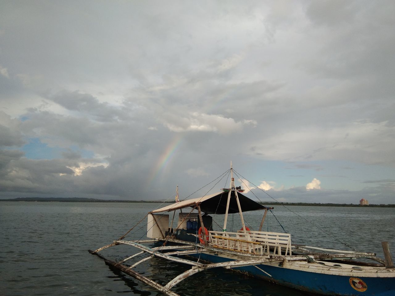 cloud - sky, sky, water, nautical vessel, transportation, sea, mode of transportation, beauty in nature, scenics - nature, nature, day, horizon, moored, horizon over water, no people, outdoors, tranquility, tranquil scene, idyllic, sailboat, fishing boat, fishing industry