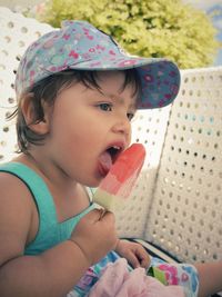 Cute girl eating popsicle