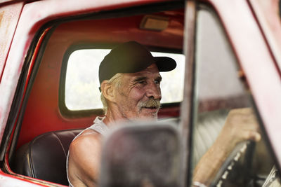 Senior man driving an old pick up