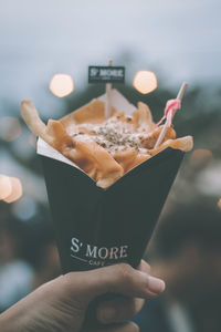 Close-up of hand holding ice cream