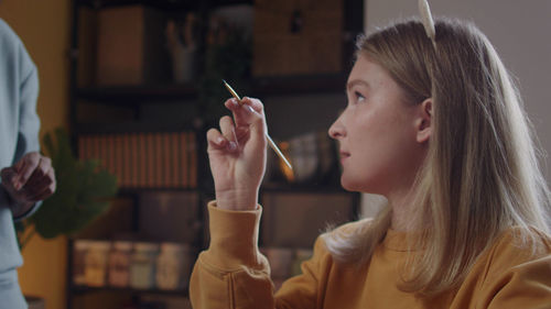 Young woman smoking cigarette