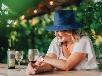 Woman sitting on table at restaurant