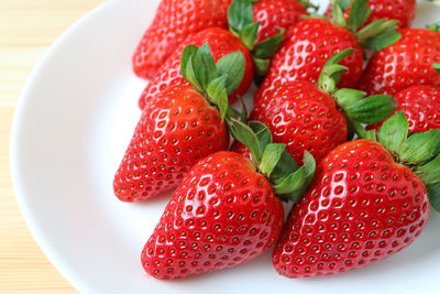 High angle view of strawberries in bowl on table