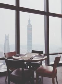 Empty chairs and tables in restaurant