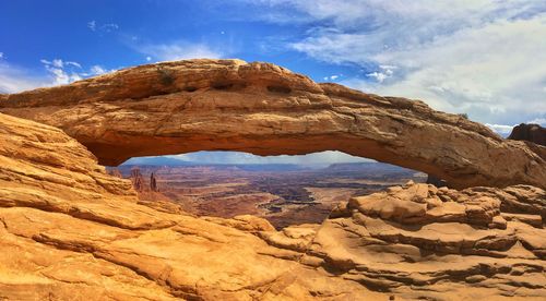 Low angle view of rock formations against sky