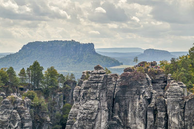 Panoramic view of rock formations against sky