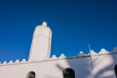 Low angle view of building against blue sky