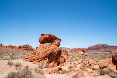 Rock formation in desert against clear sky