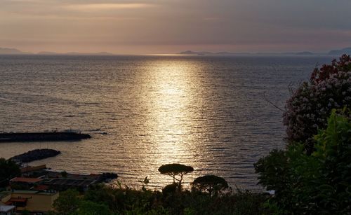 Scenic view of sea against sky at sunset