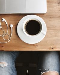 Directly above shot of coffee cup on table