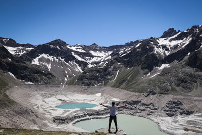 Dream come true for a boy with an athletic figure standing over the drained finstertal dam 