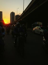 View of city street at sunset