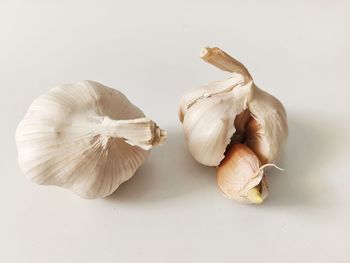 Close-up of garlic on white background