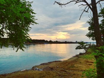 Scenic view of lake against sky during sunset