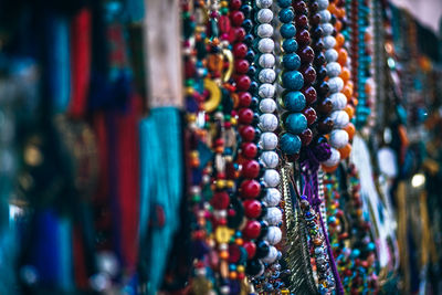 Close-up of multi colored jewelry at market stall