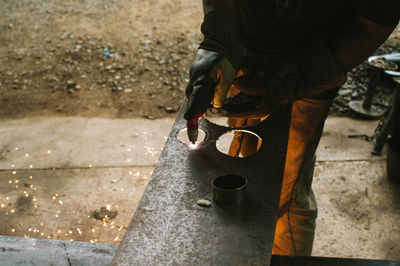 Low section of man working on street