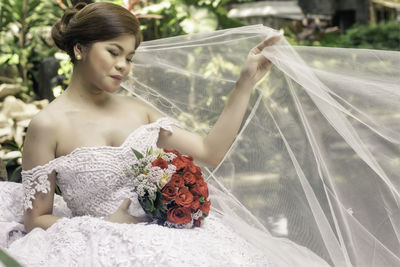 Portrait of happy bride outdoors