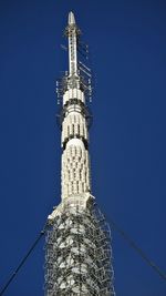 Low angle view of tower against clear blue sky