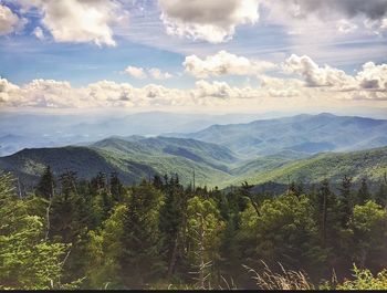 Scenic view of mountains against cloudy sky