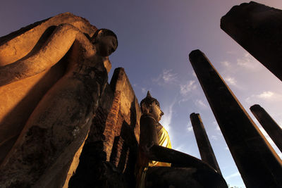 Low angle view of large buddha statue