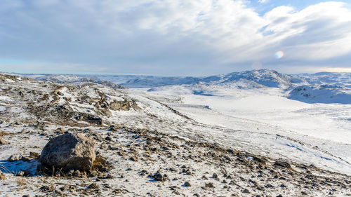 Scenic view of landscape against sky during winter