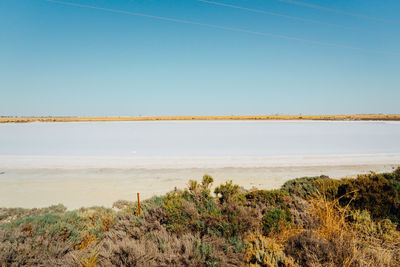 Scenic view of sea against clear sky