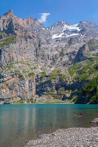 Scenic view of lake and mountains against sky