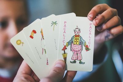 Close-up of human hand holding paper