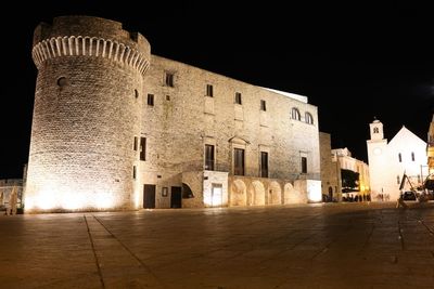 Buildings in city at night