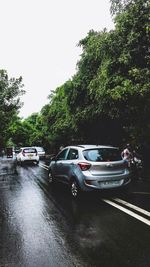 Cars on wet street in rainy season