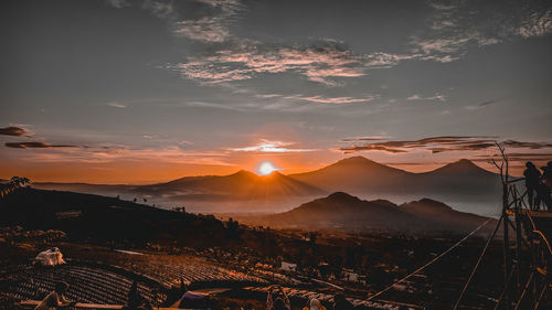 Scenic view of mountains against sky during sunset