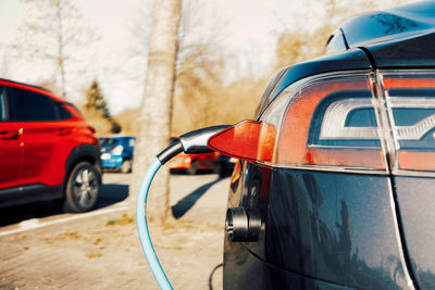 Detail view of electric car in charging station