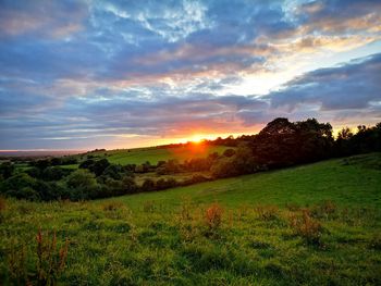 Scenic view of landscape against sky during sunset