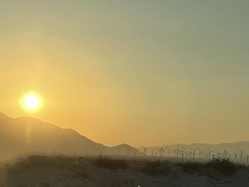 Scenic view of silhouette mountains against sky during sunset