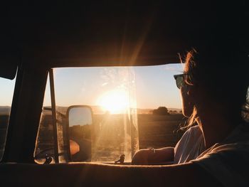 Side view of woman in car