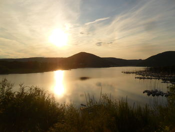 Scenic view of lake against sky during sunset