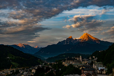 View of buildings against cloudy sky during sunset