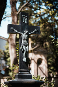 Statue of cross in cemetery