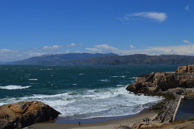 Scenic view of sea against blue sky