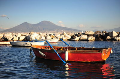 Boat on shore against sky