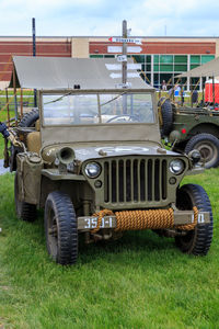 Vintage car parked on field