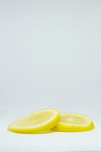 Close-up of lemon slice against white background